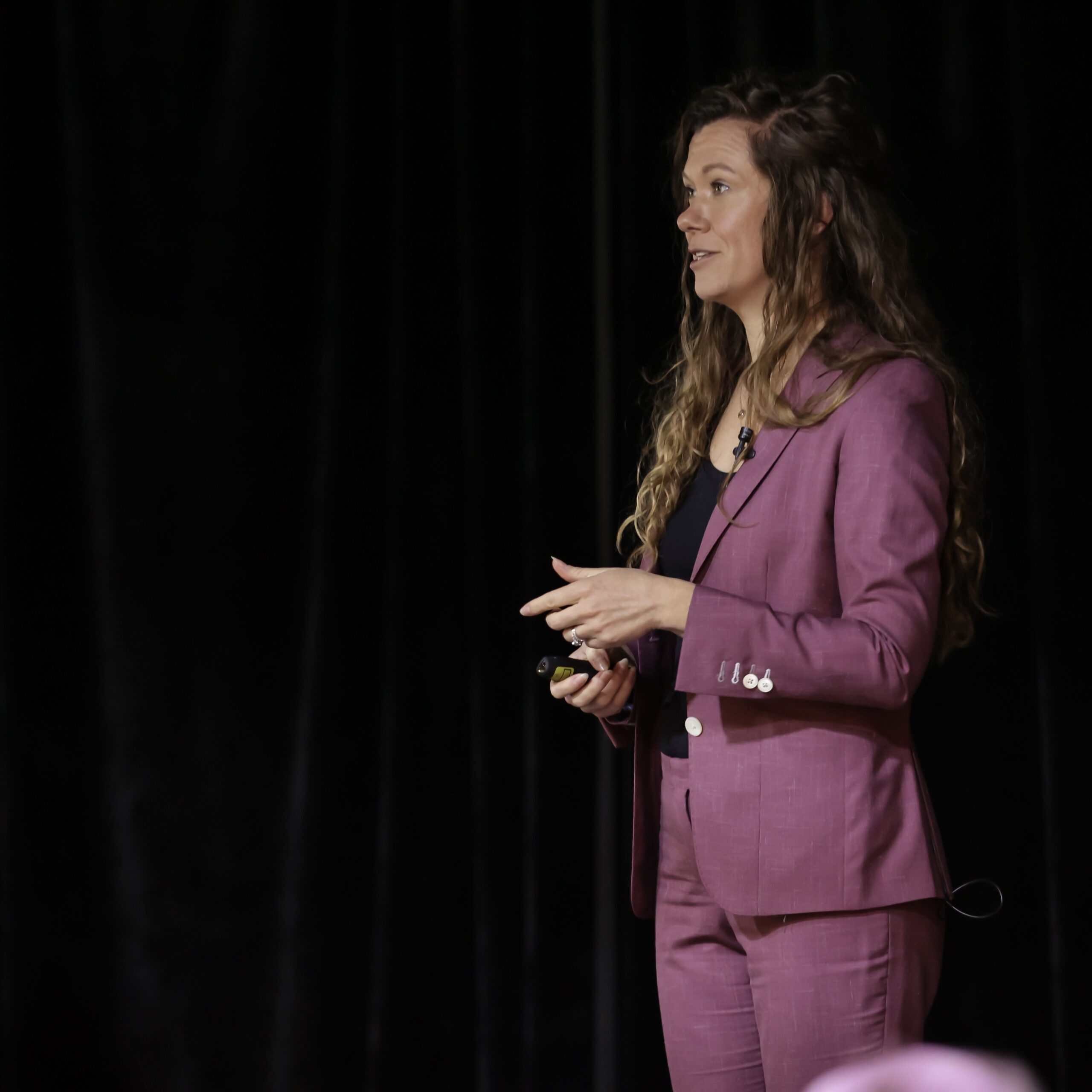 Gena Parker speaking on stage